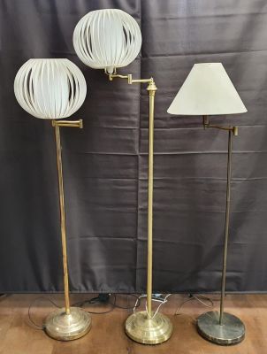 Three floor-standing brass lamps and shades (3)