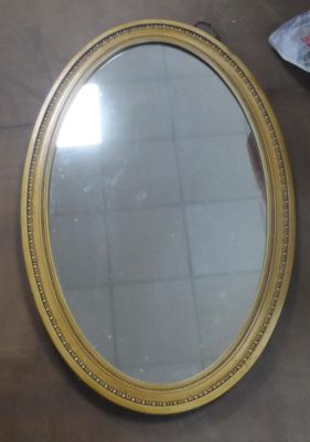 Gilt framed, oval wall mirror