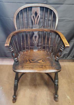 A dark oak captains chair