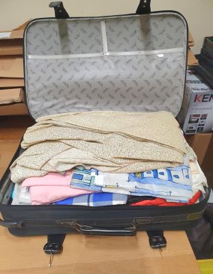 Large Shilton International suitcase filled with clean ladies clothes