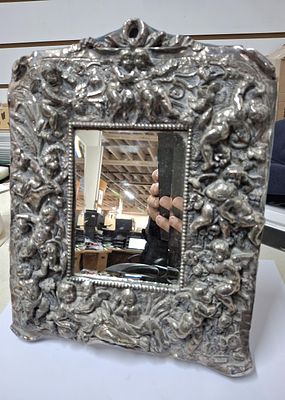 Stunning, free-standing photo frame with heavy sterling silver frontage with detailed 3-D style 