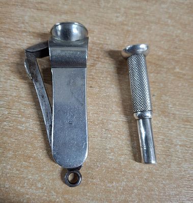 Hallmarked silver cigar cutter together with a hallmarked silver cigar piercer (2), 33 grams