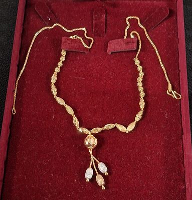 Boxed, ladies gilt metal decorative necklace