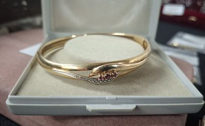 Boxed 9ct yellow gold solid bracelet with diamond and Ruby chips, 10.3 grams gross
