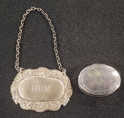 Birmingham hallmarked silver "RUM" decanter label together with a 925 silver pill box, 22.5 