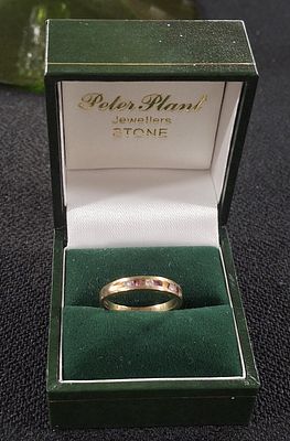 Hallmarked 18ct gold ladies ring with round cut small diamonds and Rubies in a presentation box 