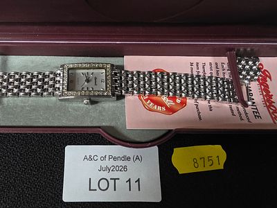 Ladies' Ingersoll wristwatch in original case with spare link etc.