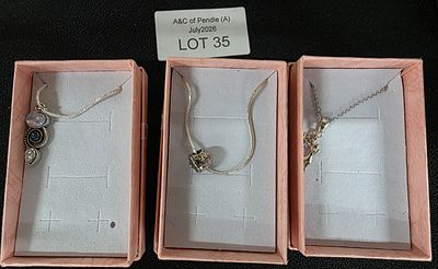 Three 925 necklaces with various silver pendants (3)