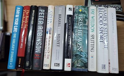 Box of approx 11 signed, first edition hardback books to include Fay Weldon, James B Stewart 