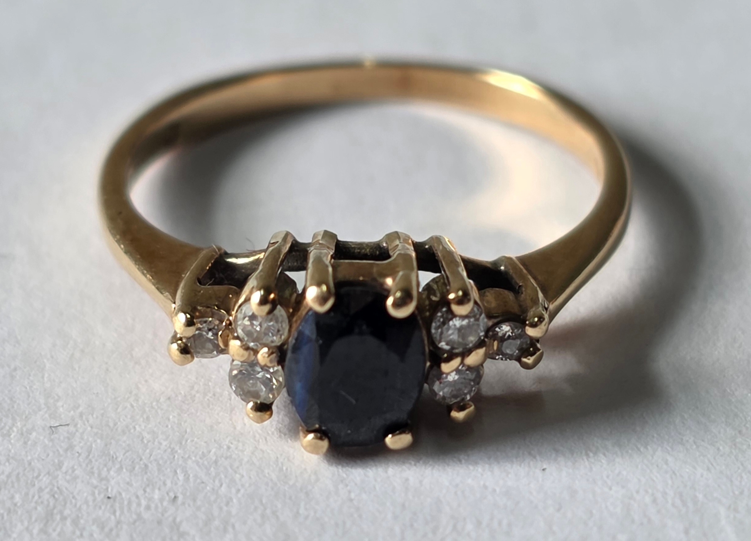 A 9ct. Gold, Sapphire & six Diamond ring, 1.6 grams, size i