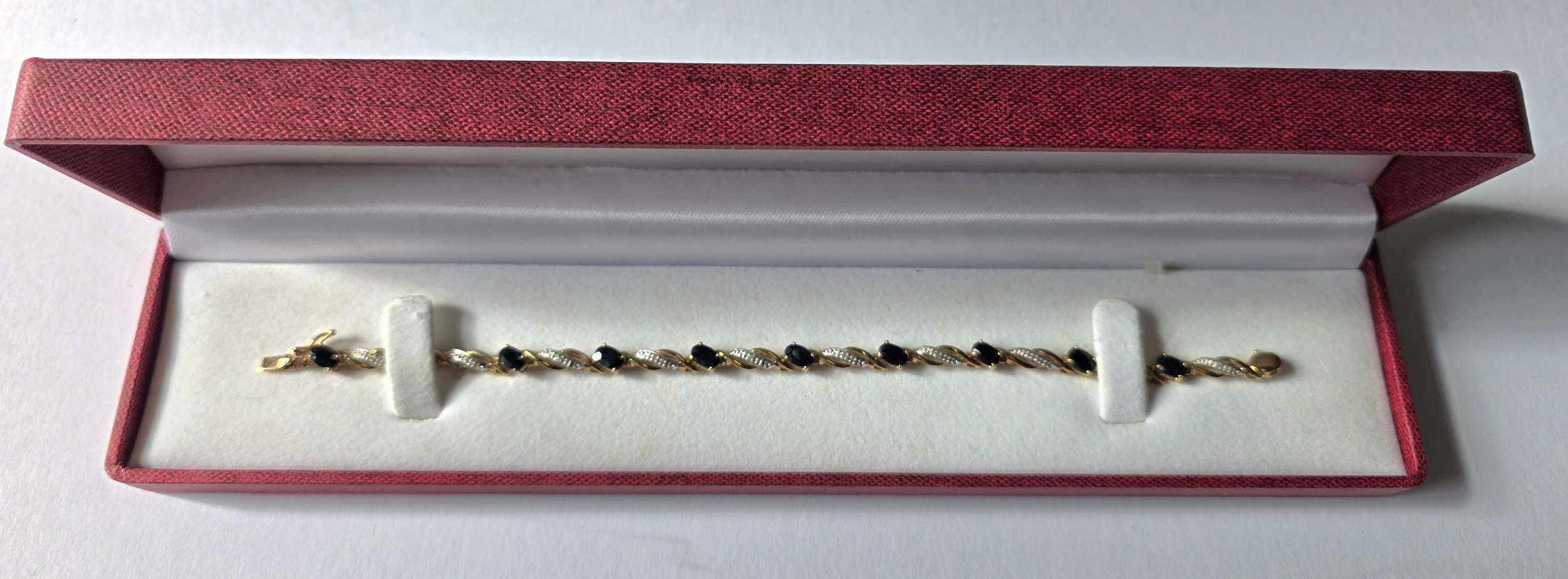 A stunning cased 9ct. Gold, Sapphire & Diamond bracelet, 7.65 grams