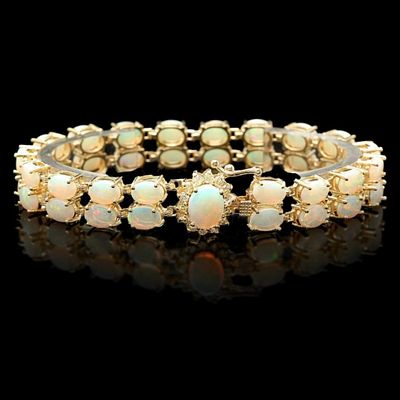 14k Gold 14.00ct Opal & 0.50ct Diamond Bracelet. This solid 14K yellow gold bracelet is set with 