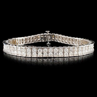 14K Gold 4.61ctw Diamond Bracelet. This solid 14K white gold bracelet is set with round 