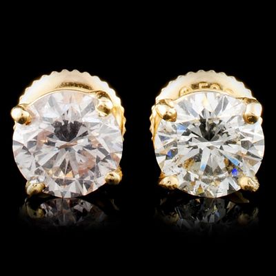 14K Gold 1.70ctw Diamond Earrings. These solid 14K yellow gold earrings feature round 