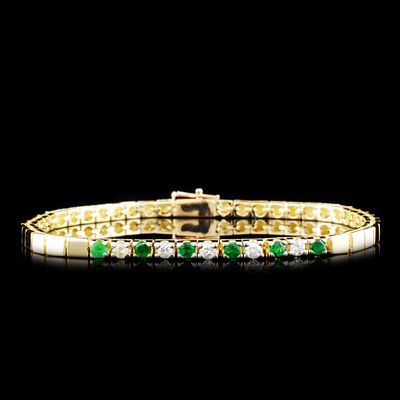 14K Gold 0.32ctw Emerald & 0.24ctw Diamond Bracele. This solid 14K yellow gold bracelet is set 