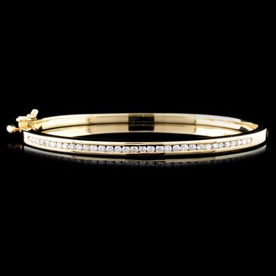 14K Gold 1.20ctw Diamond Bracelet. This solid 14K yellow gold bracelet is set with round 