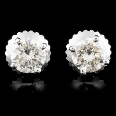 14K Gold 0.70ctw Diamond Earrings. These solid 14K white gold earrings feature round 
