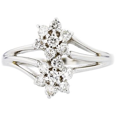 18K White Gold 0.55ctw Diamond Flower Cluster Ring. Estimated Retail Replacement Value: $4 
