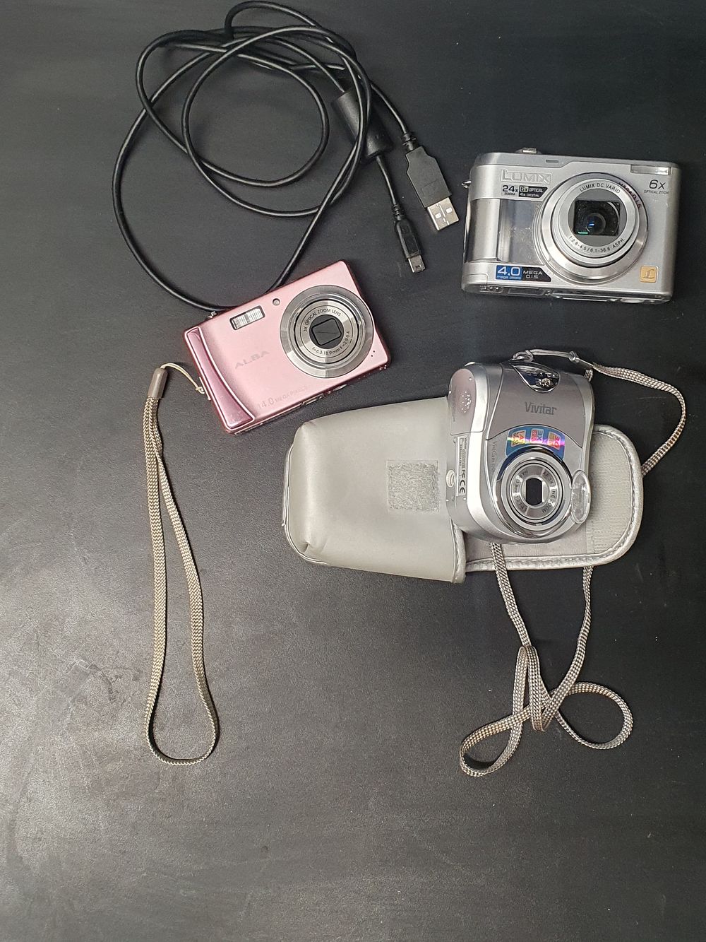 Lot 167: A Trio of Vintage Digital Compact Cameras