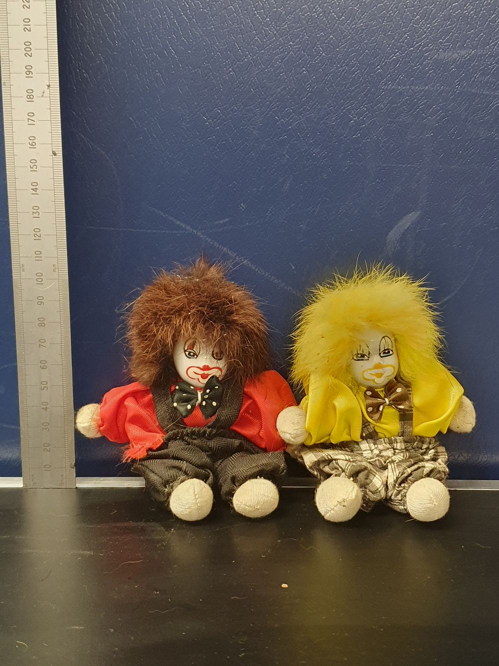 Lot 173: A Pair of Miniature Hand-Painted Porcelain-Headed Clown Dolls
