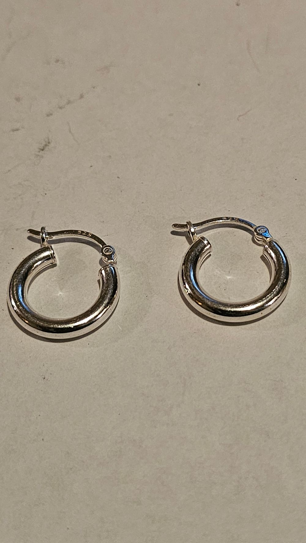 Lot 208: A Pair of Sterling Silver Tubular Hoop Earrings