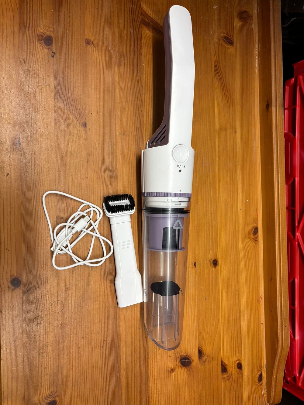 Lot 231: A modern cordless handheld vacuum cleaner with accessories - As new