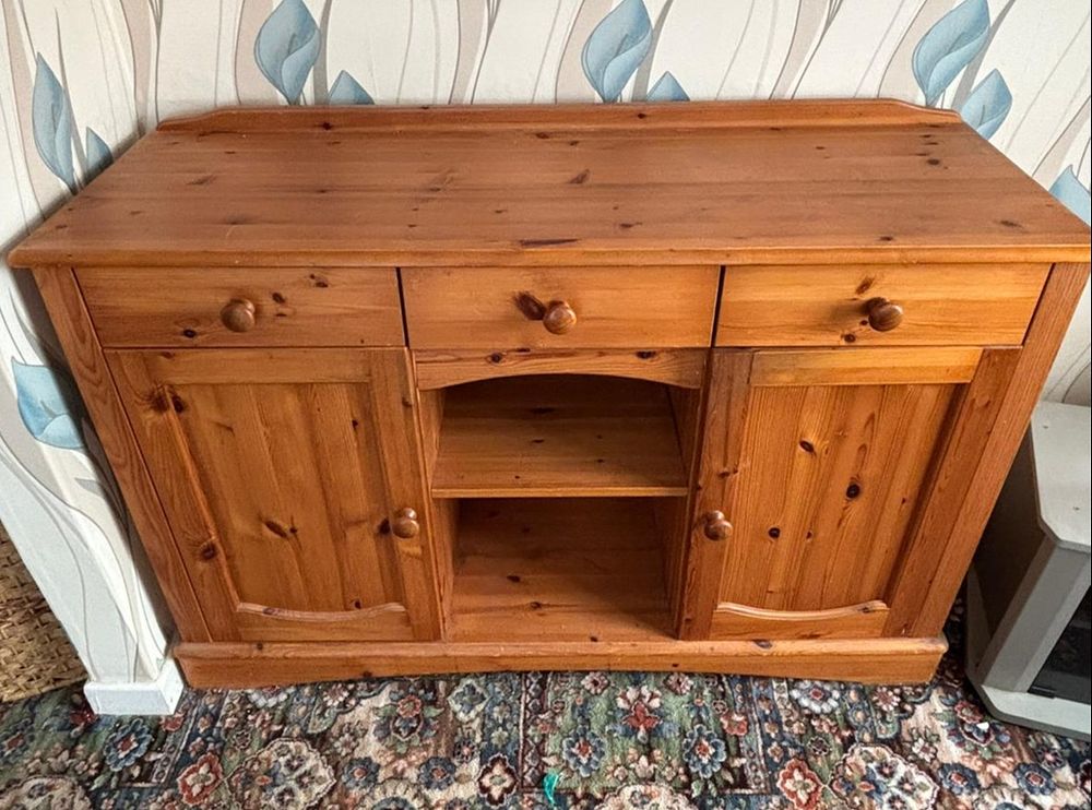 Lot 235: A Danish Style Knotty Pine Sideboard