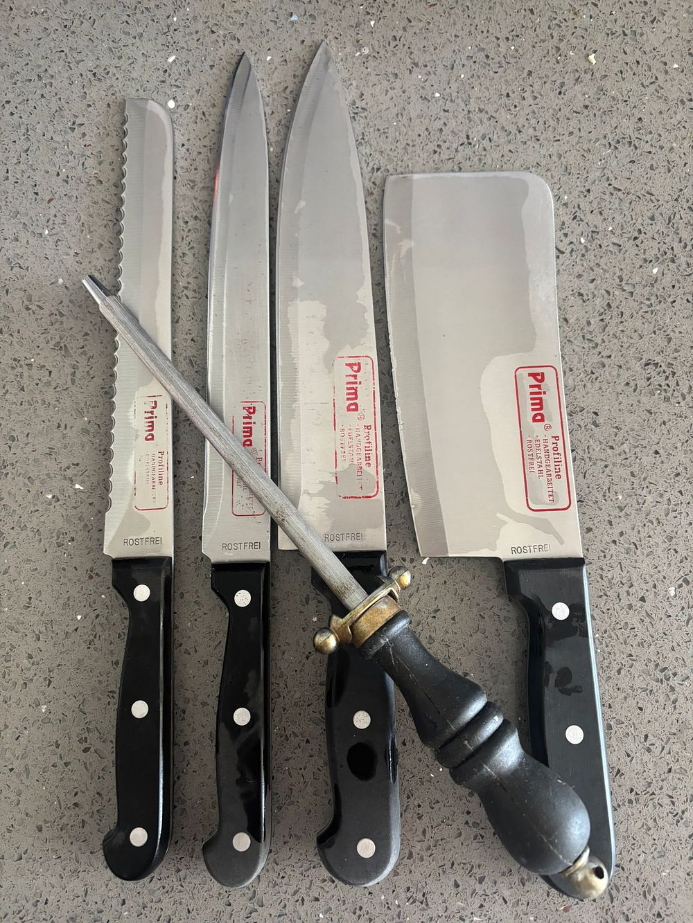Lot 254: A Set of Prima Profiline Stainless Steel Kitchen Knives and Sharpening Steel