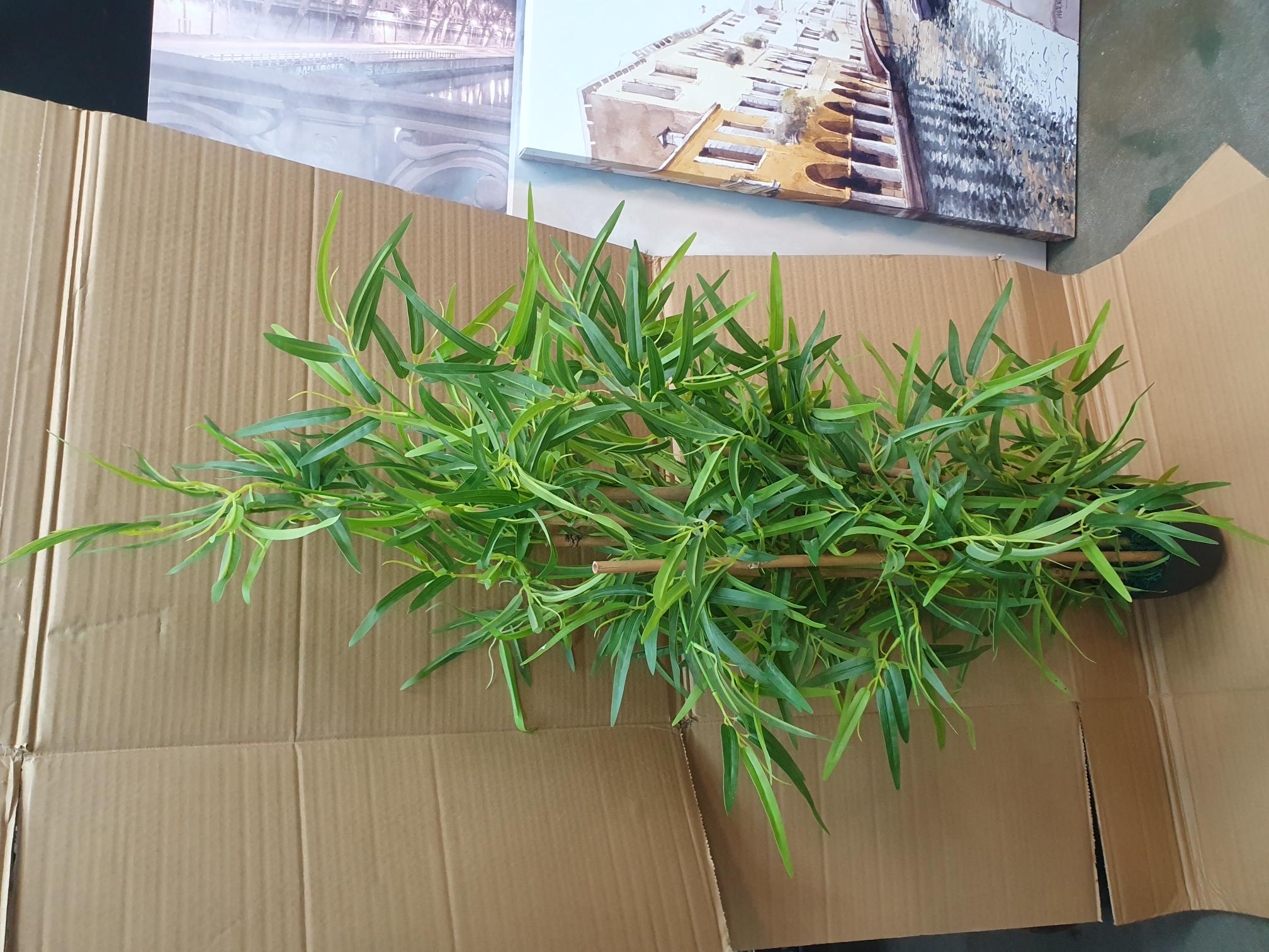 Artificial Bamboo Plant in a Black Plastic Pot