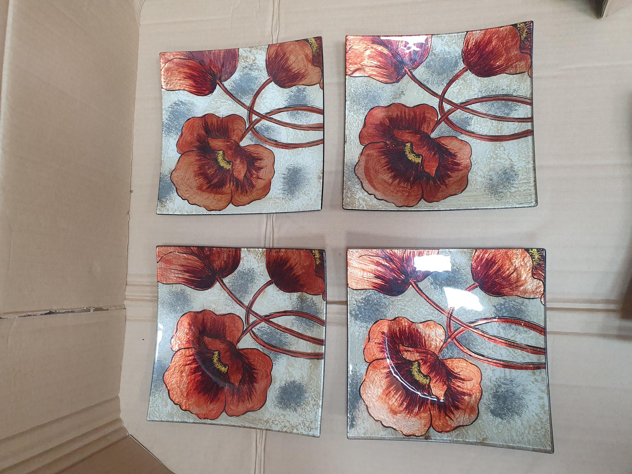 A Set of Four Contemporary Poppy Motif Square Glass Plates