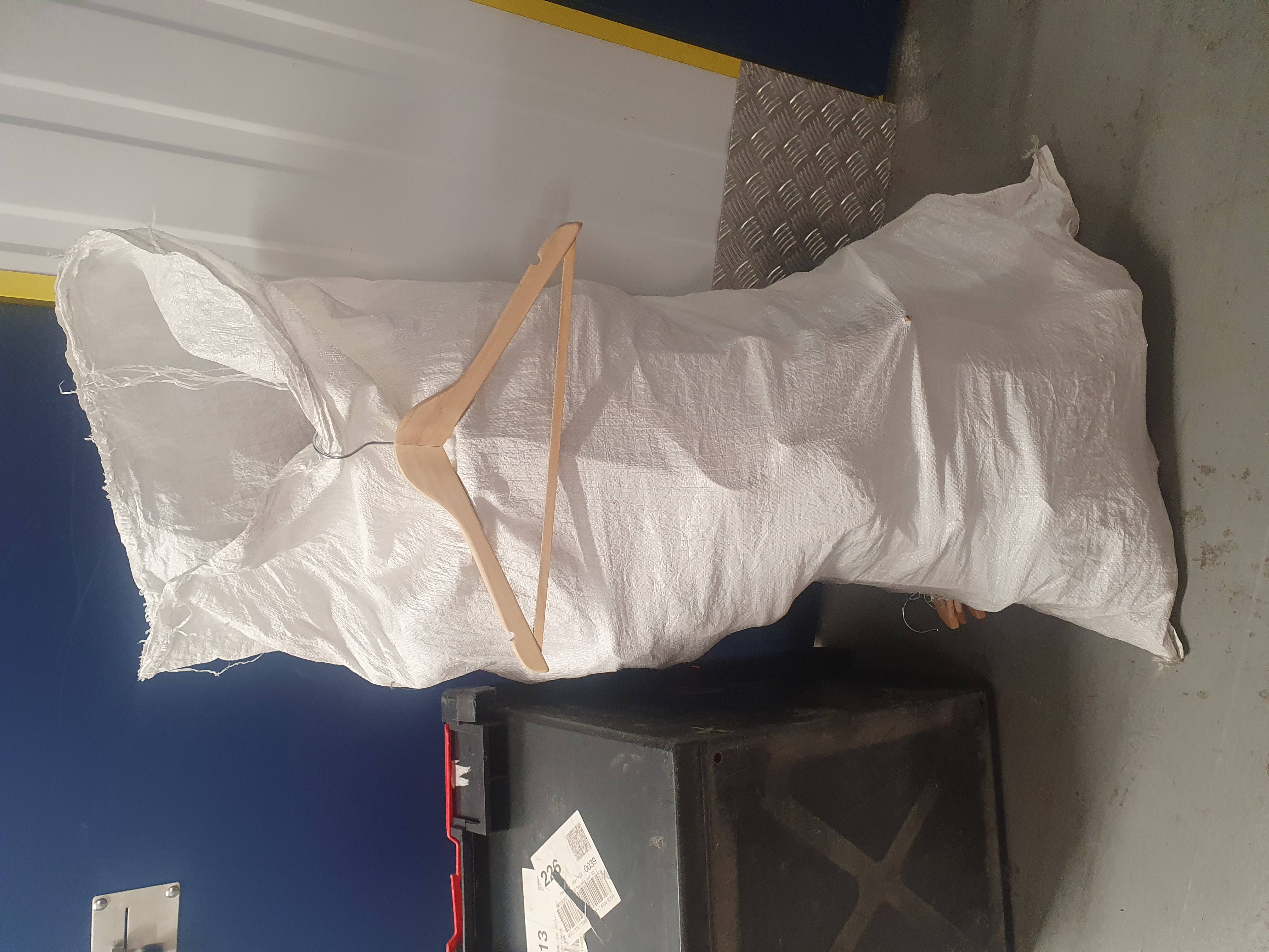 A Large Assortment of Wooden Wishbone Clothes Hangers in an FIBC Bulk Bag, Minimum of 60 Hangers
