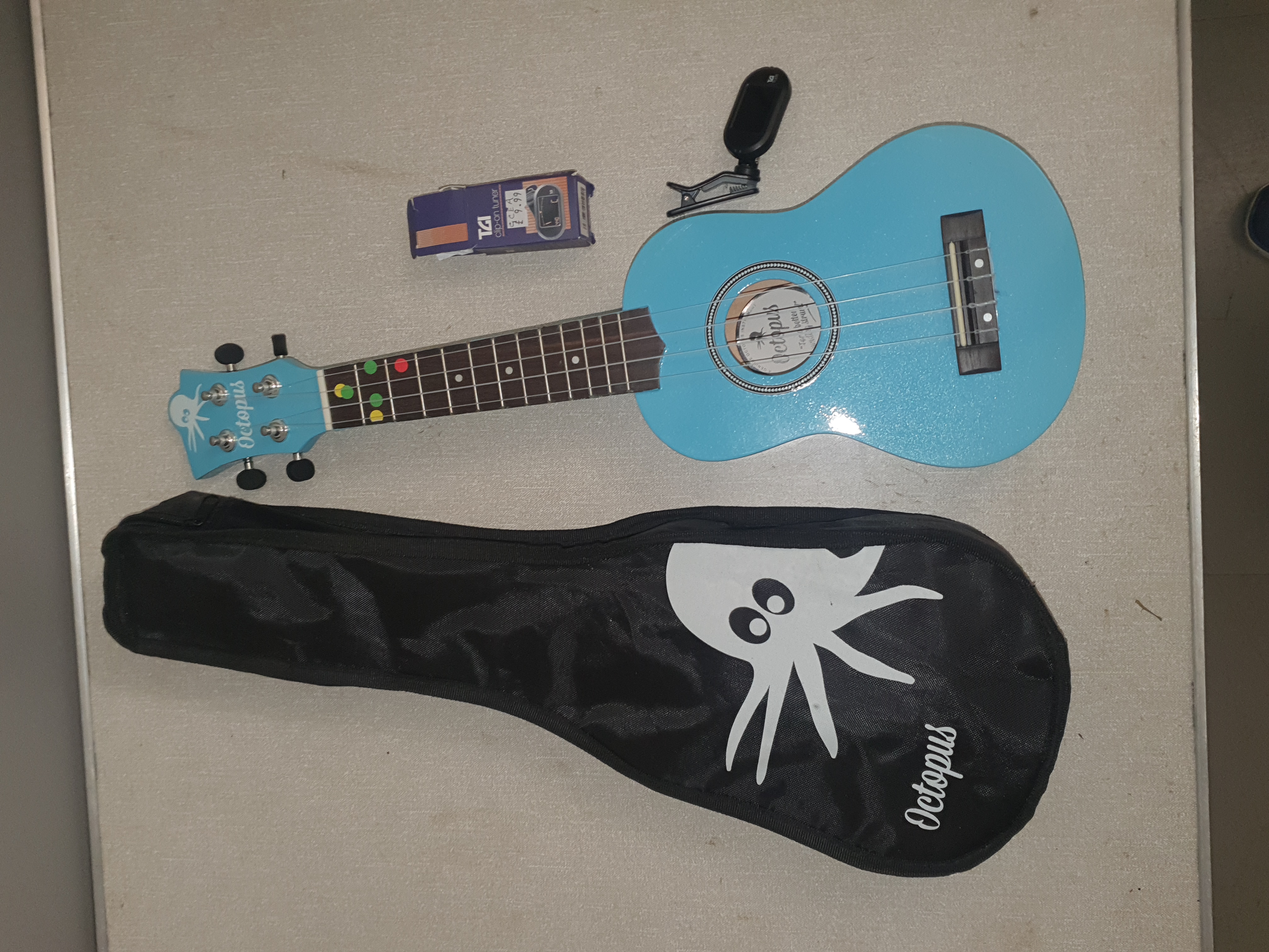 An Octopus Soprano Ukulele in Sky Blue Finish with Branded Gig Bag and TGI Tuner