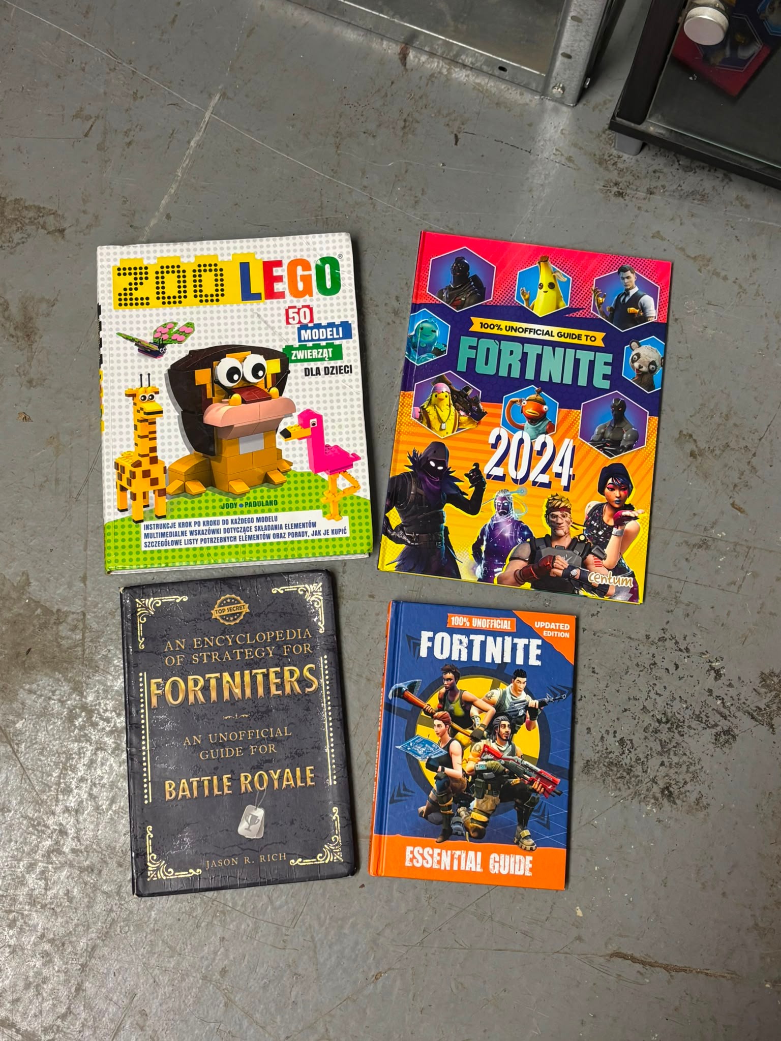 A Collection of Fortnite Strategy Guides and LEGO Instruction Manuals. Centum and others, 2017-2024.