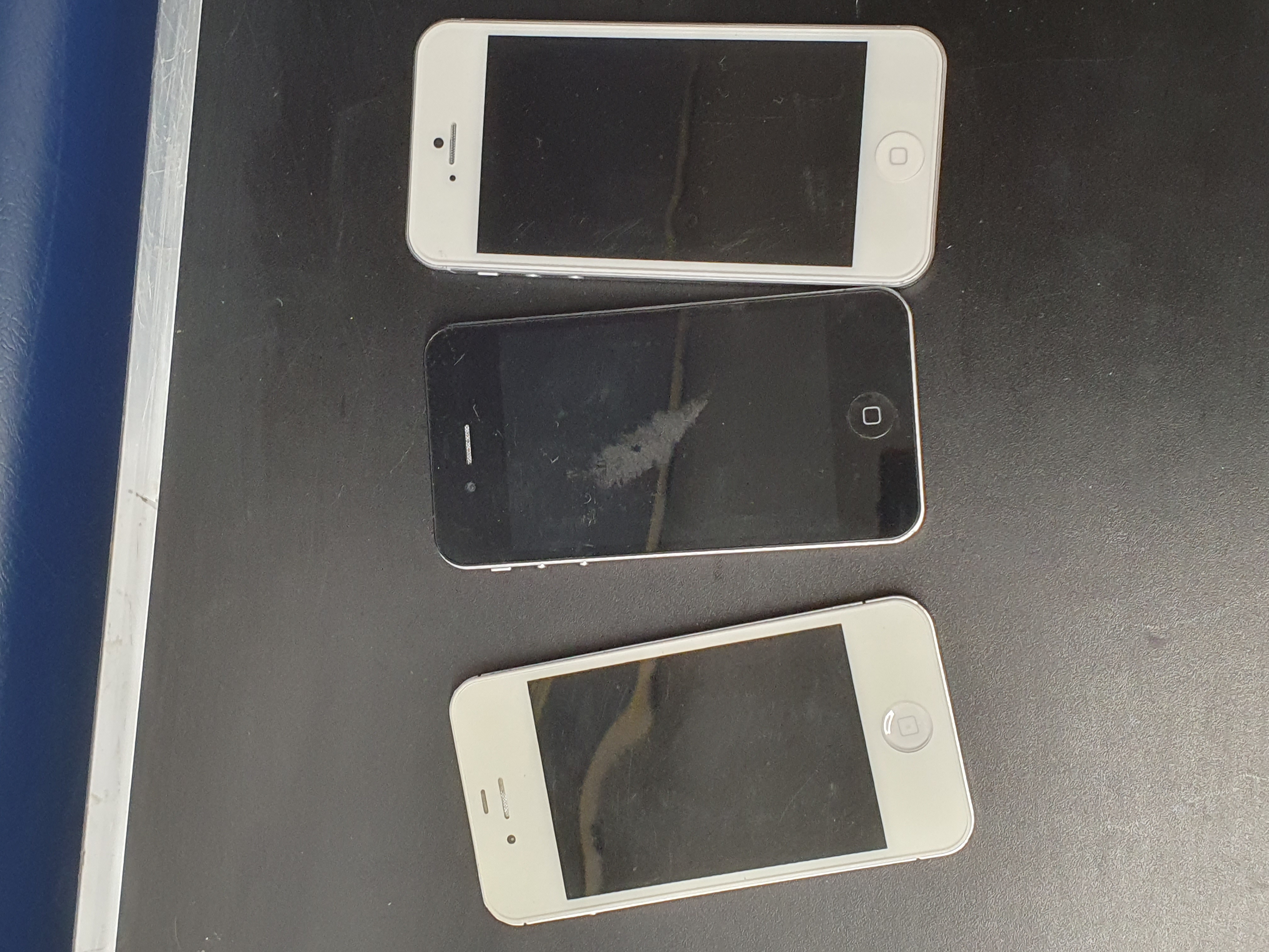 A Trio of Apple iPhones comprising iPhone 4, 4S, and 5 Models, Sold as seen, Untested