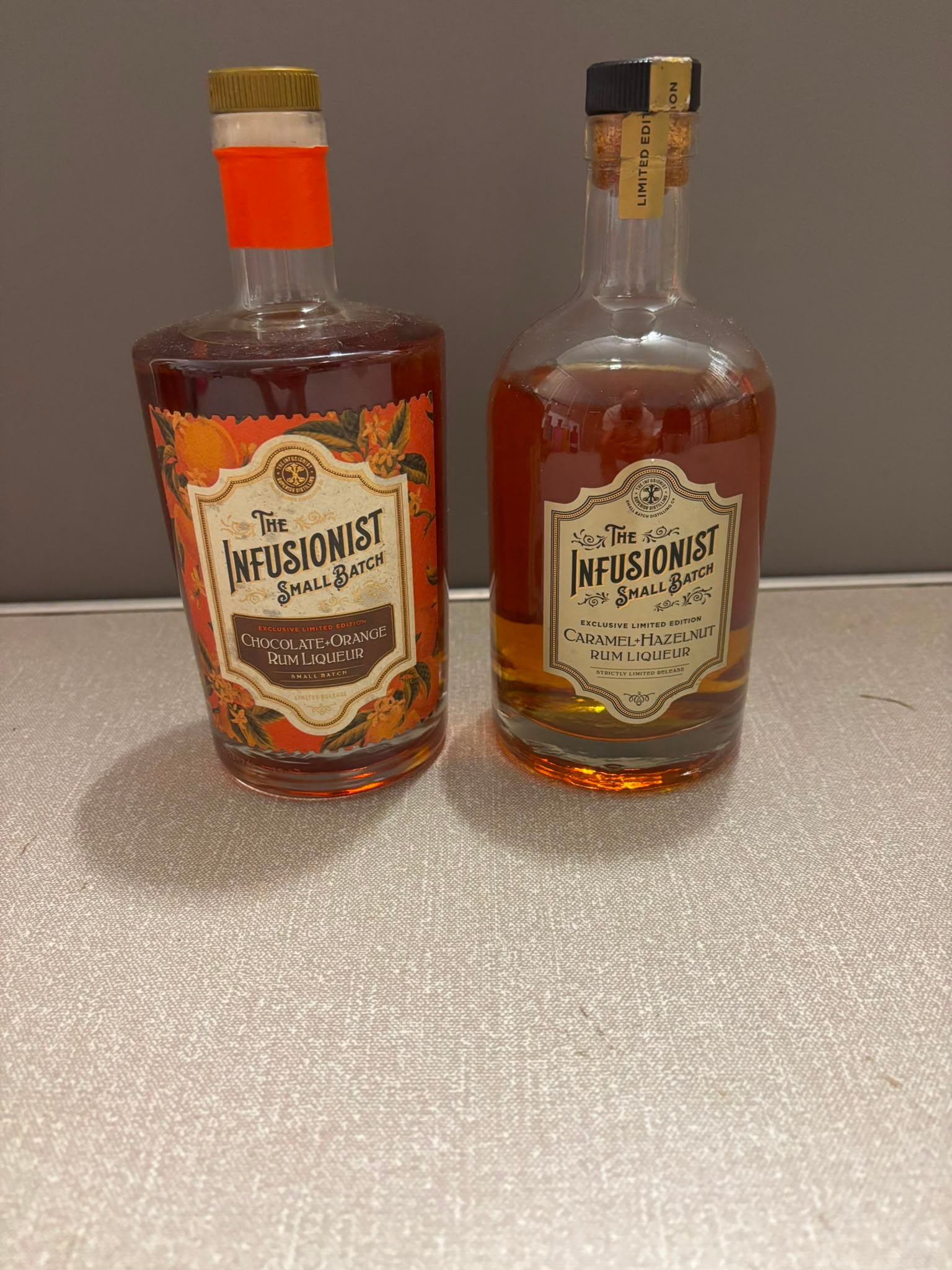 Two Bottles of The Infusionist Small Batch Rum Liqueurs