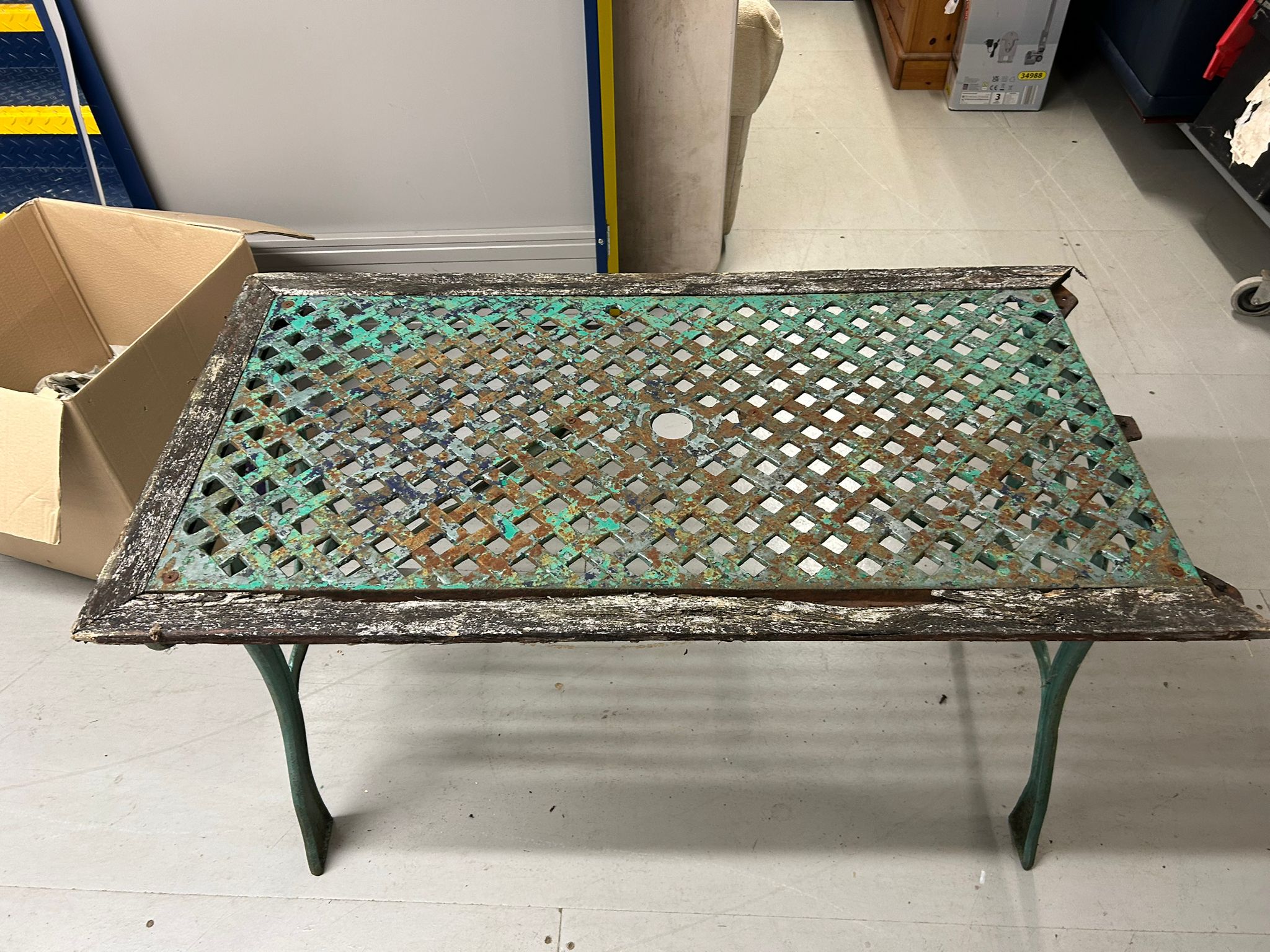 A Victorian Style Cast Iron and Timber Garden Table