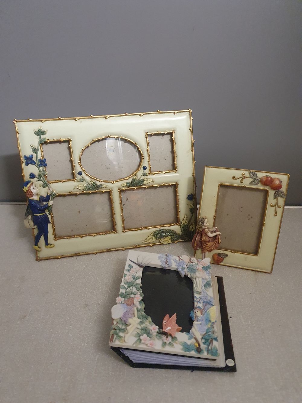 Lot 215: A Trio of Shudehill Giftware Whimsical Cast Resin Photo Frames and Album