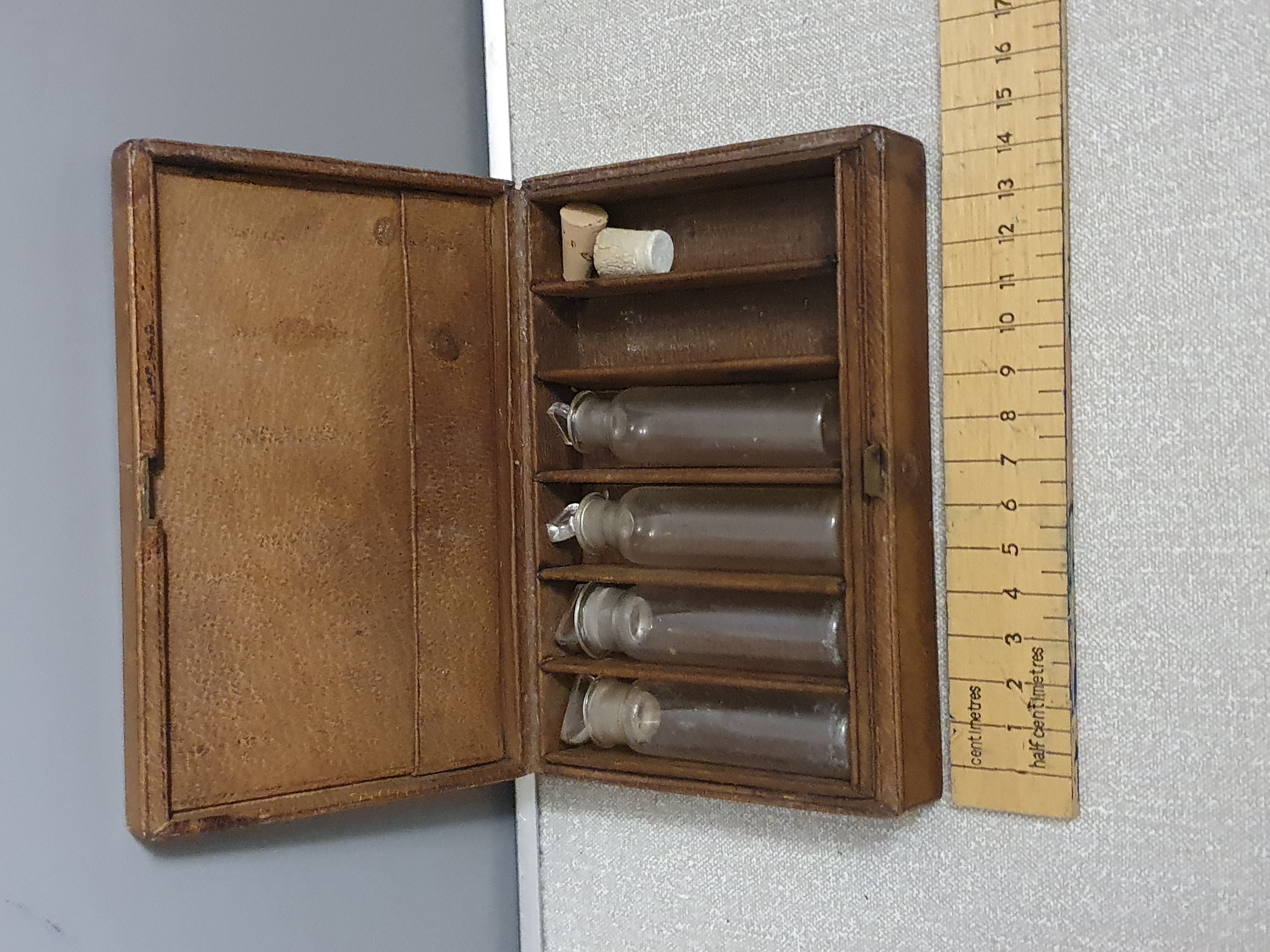 A Victorian Leather-Bound Portable Apothecary Case with Glass Vials