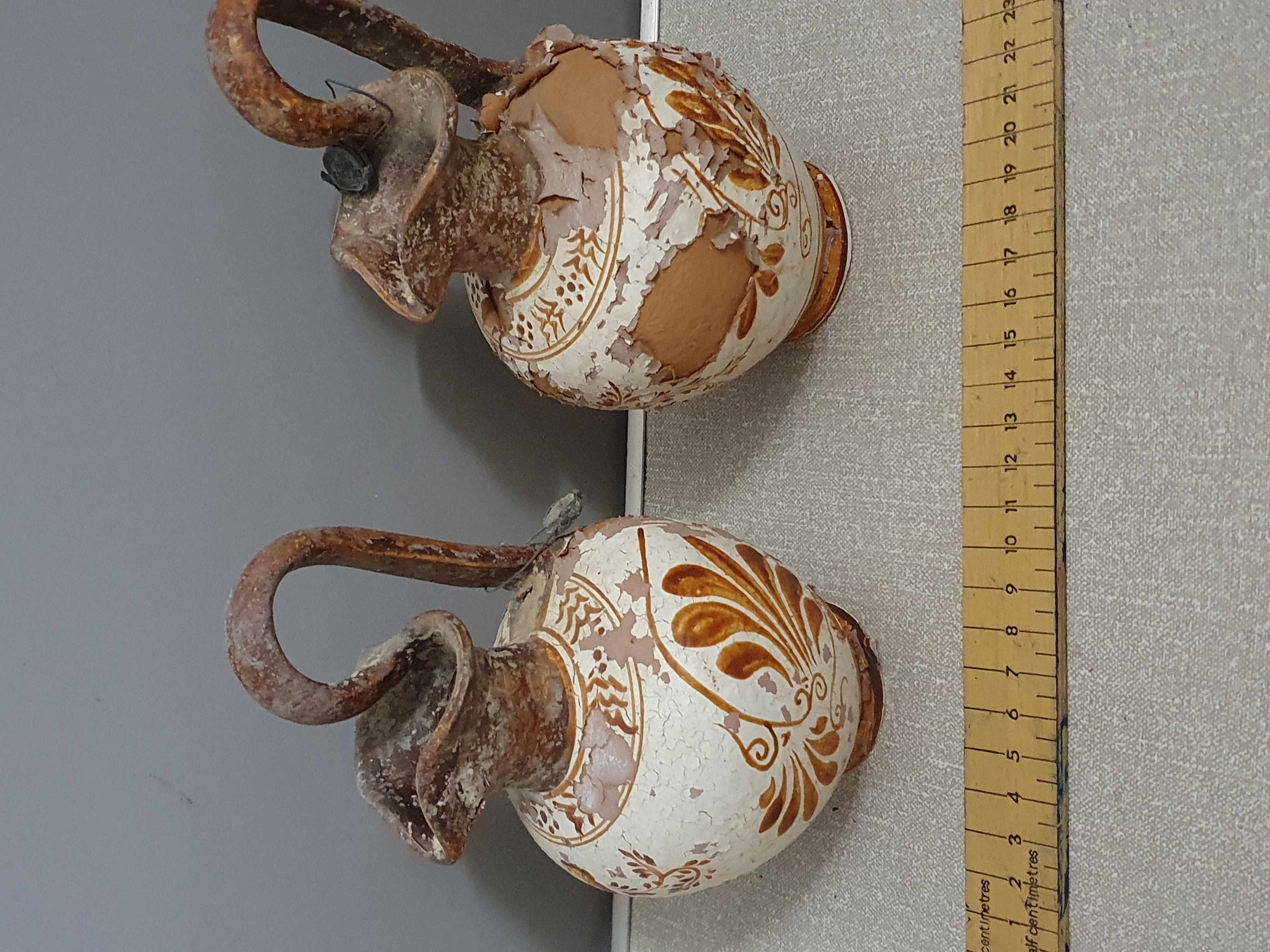 A Pair of White-Ground Style Terracotta Oinochoai