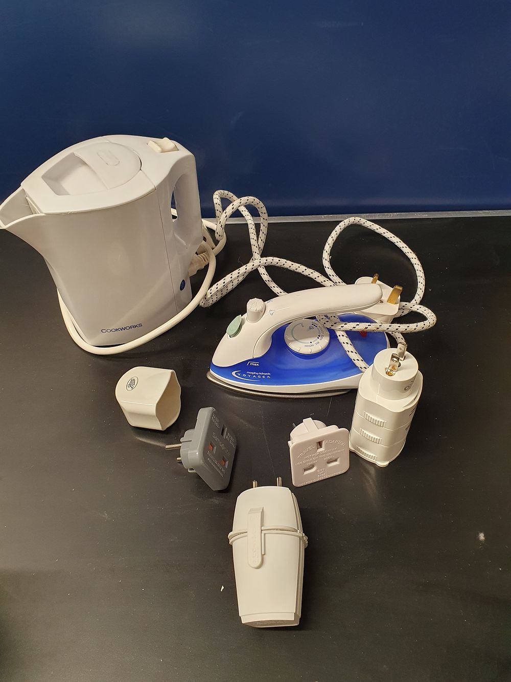 Lot 228: A Collection of Small Travel Appliances including a Morphy Richards Voyager Steam Travel Iron and Cookworks Kettle