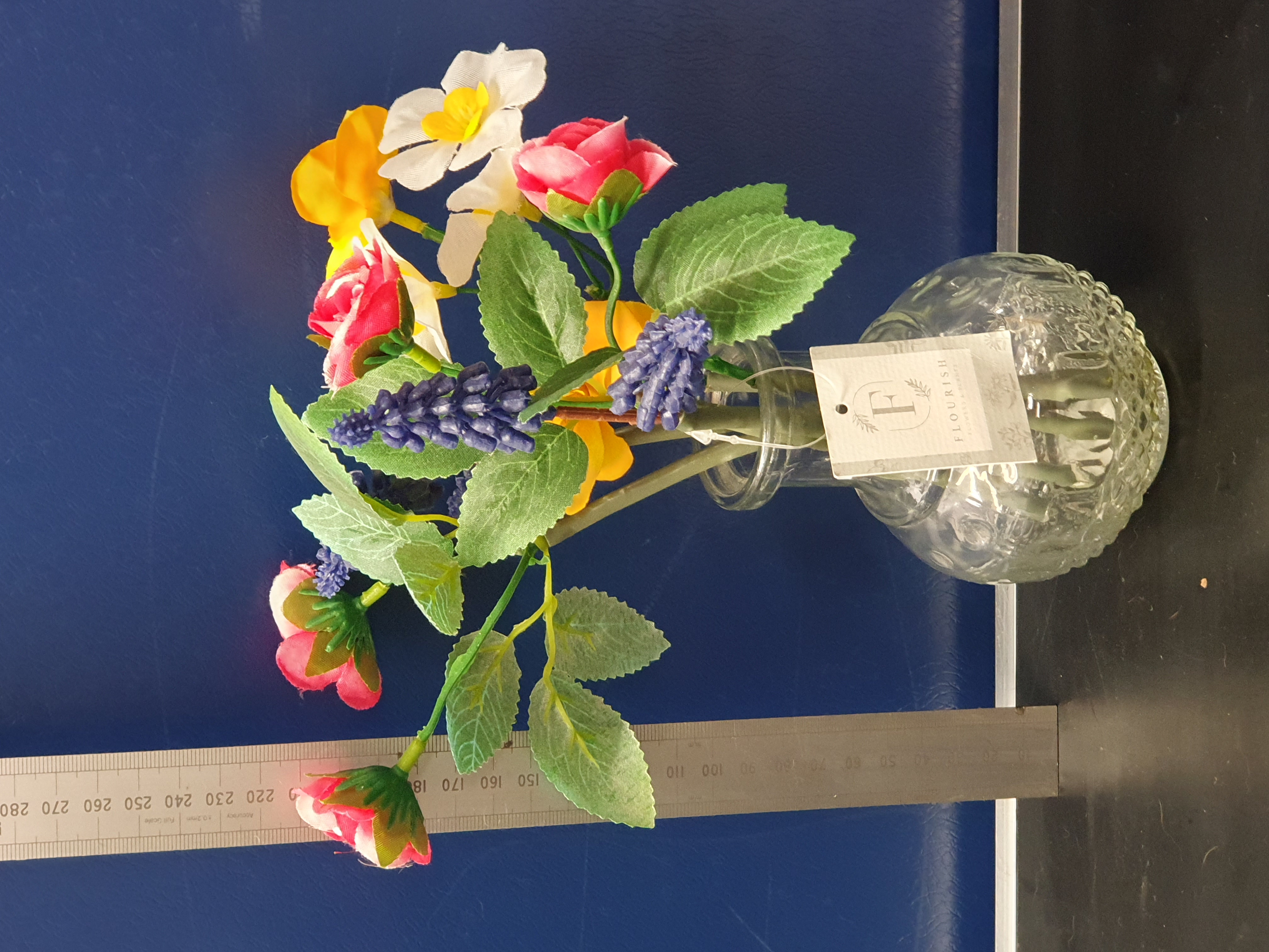 A Contemporary Artificial Floral Arrangement in a Textured Clear Glass Vase