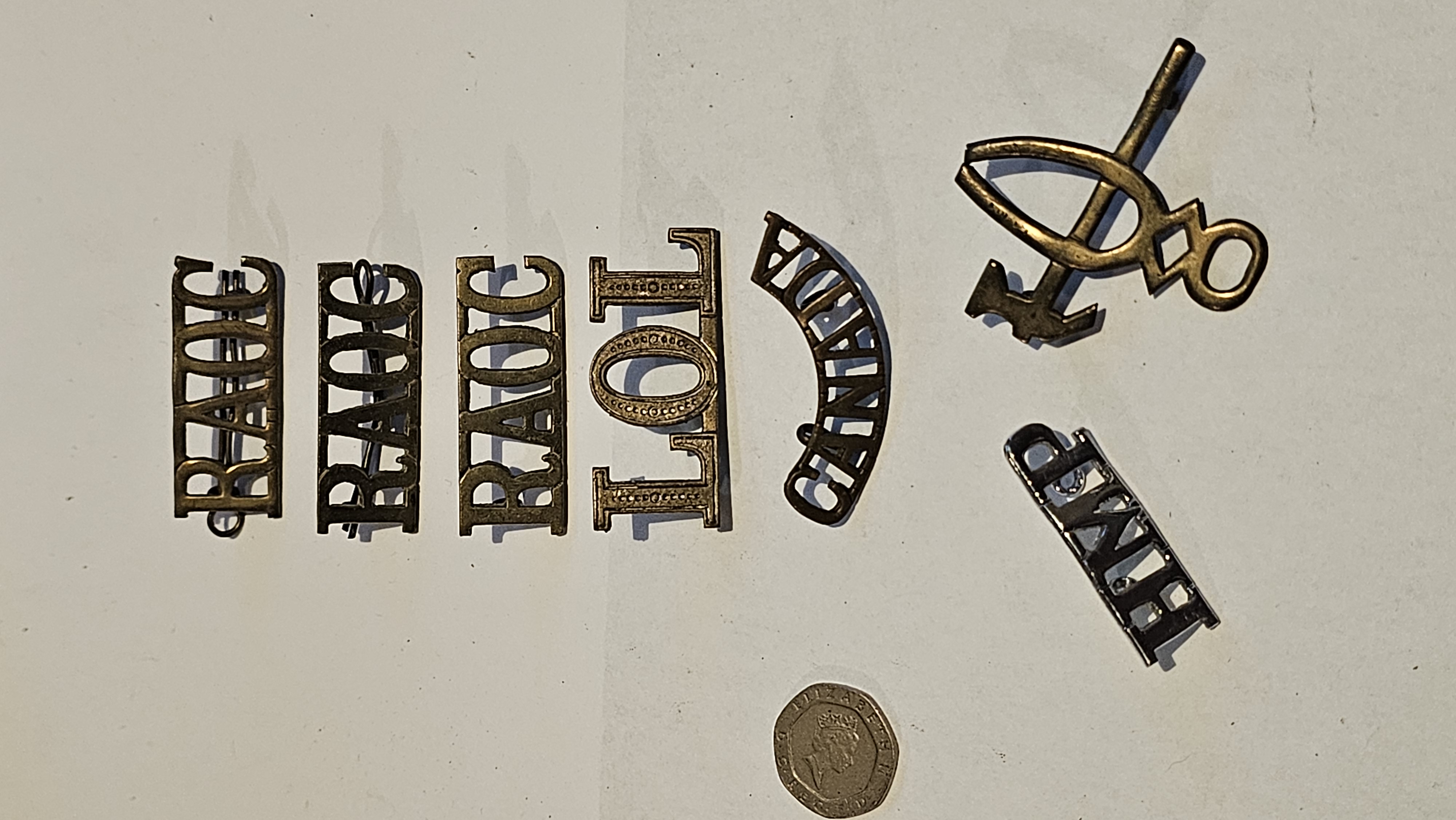 A Collection of British and Commonwealth Military and Fraternal Insignia including WWII Era RAOC Shoulder Titles