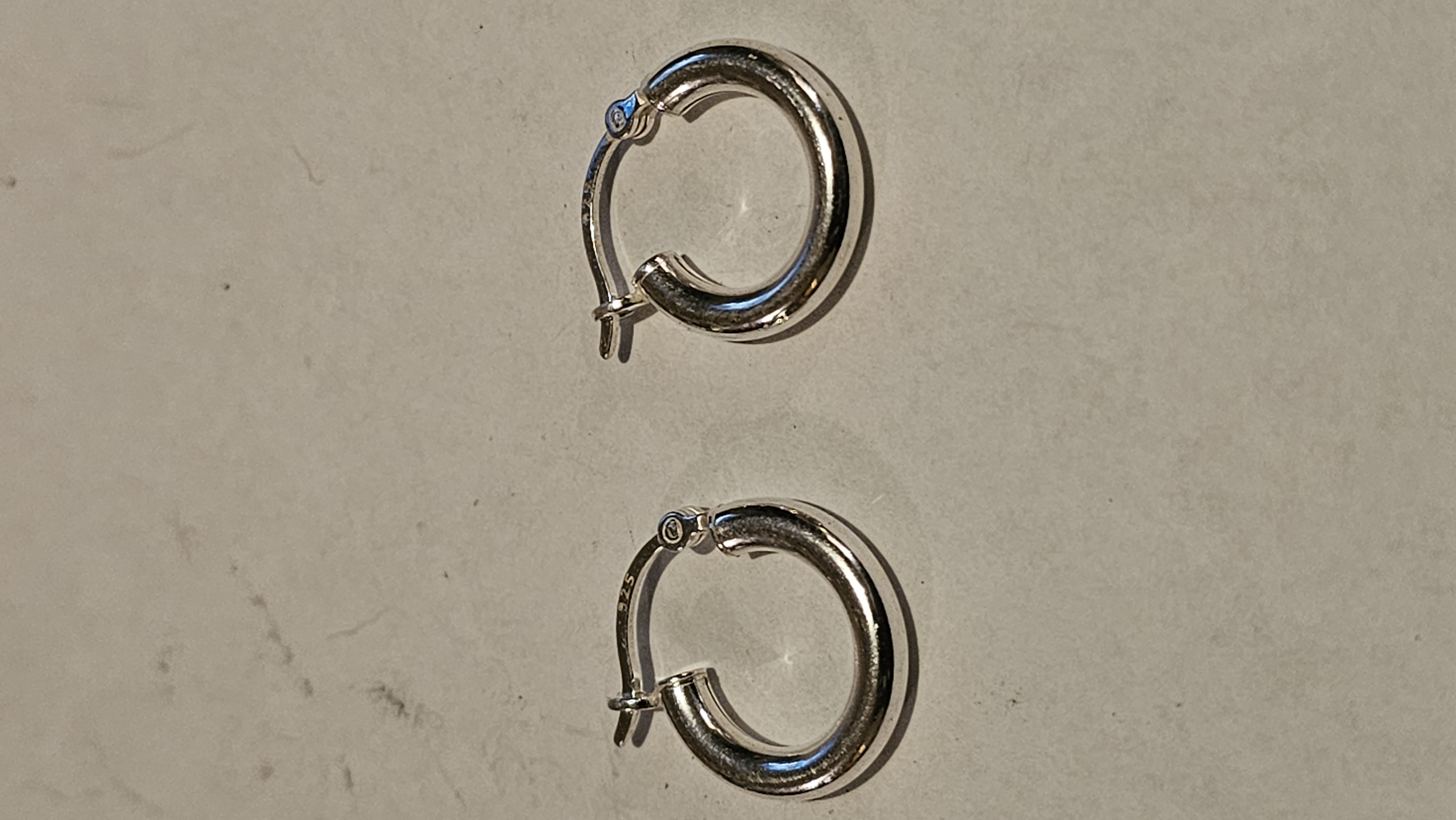 A Pair of Sterling Silver Tubular Hoop Earrings