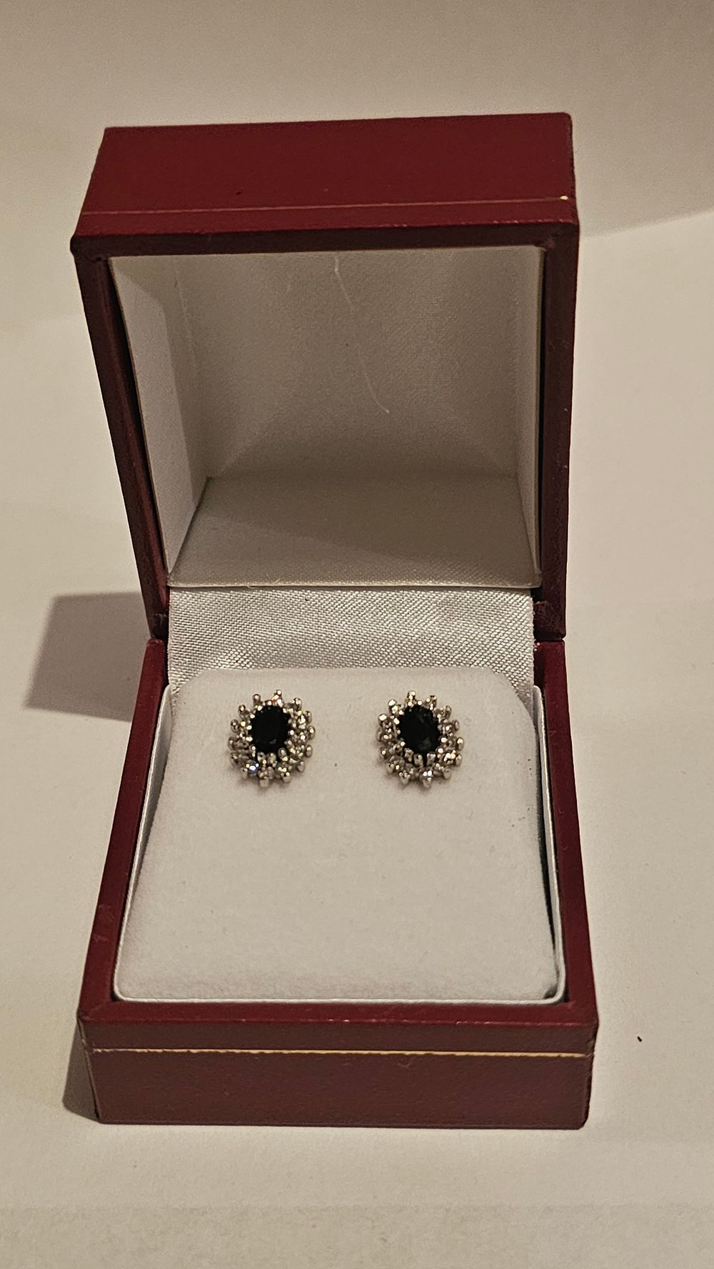Lot 265: A Pair of 9 Carat Gold Sapphire and Diamond Cluster Stud Earrings