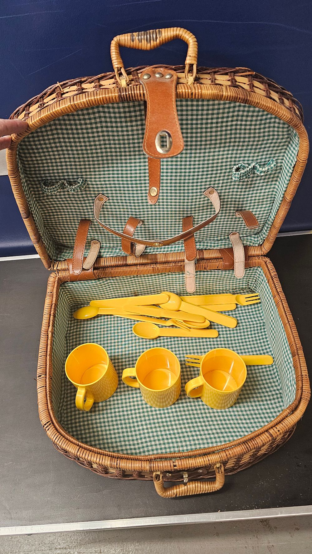 Lot 322: An incomplete vintage wicker picnic hamper with yellow plastic picnicware