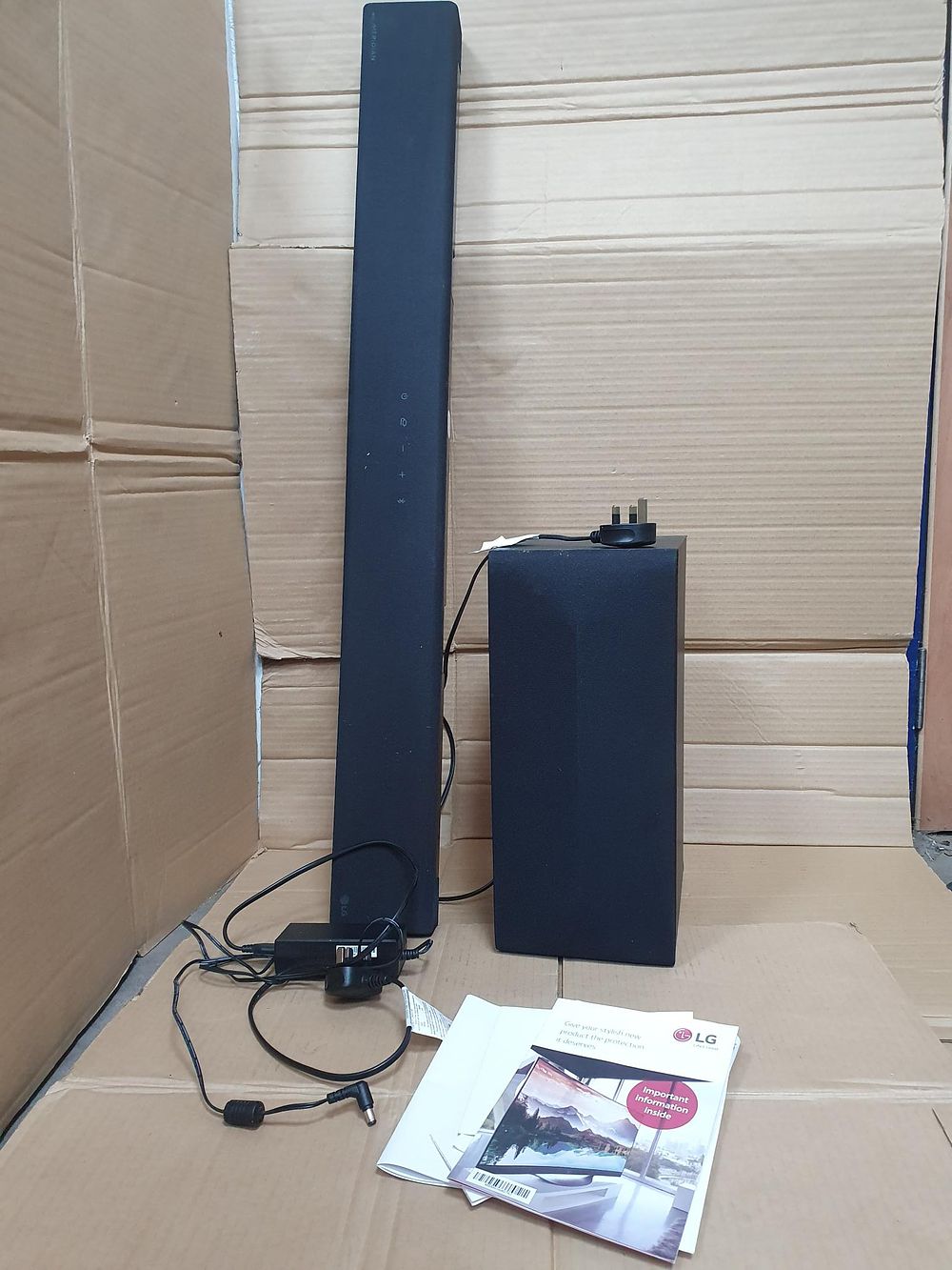 Lot 66: LG SN4 2.1 Channel Soundbar with Wireless Subwoofer and Meridian Audio, Boxed and Good Condition