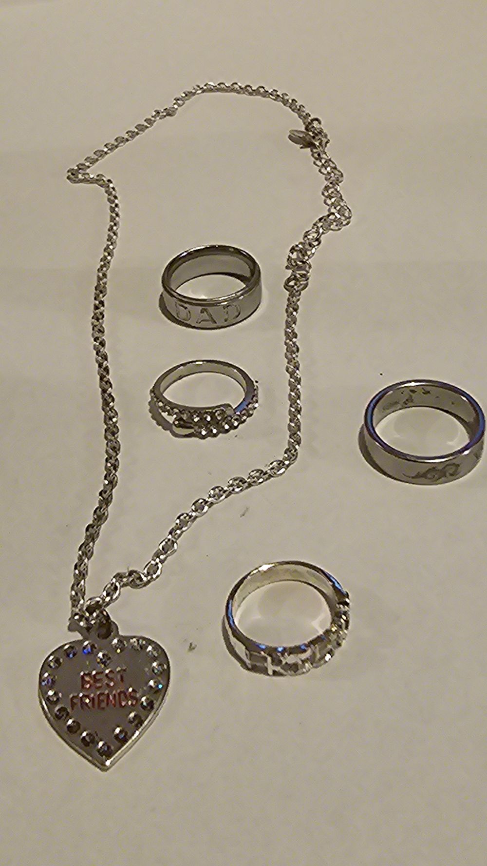 Lot 400: A Collection of Contemporary Silvertone Jewellery including Rings and a Heart Pendant Necklace