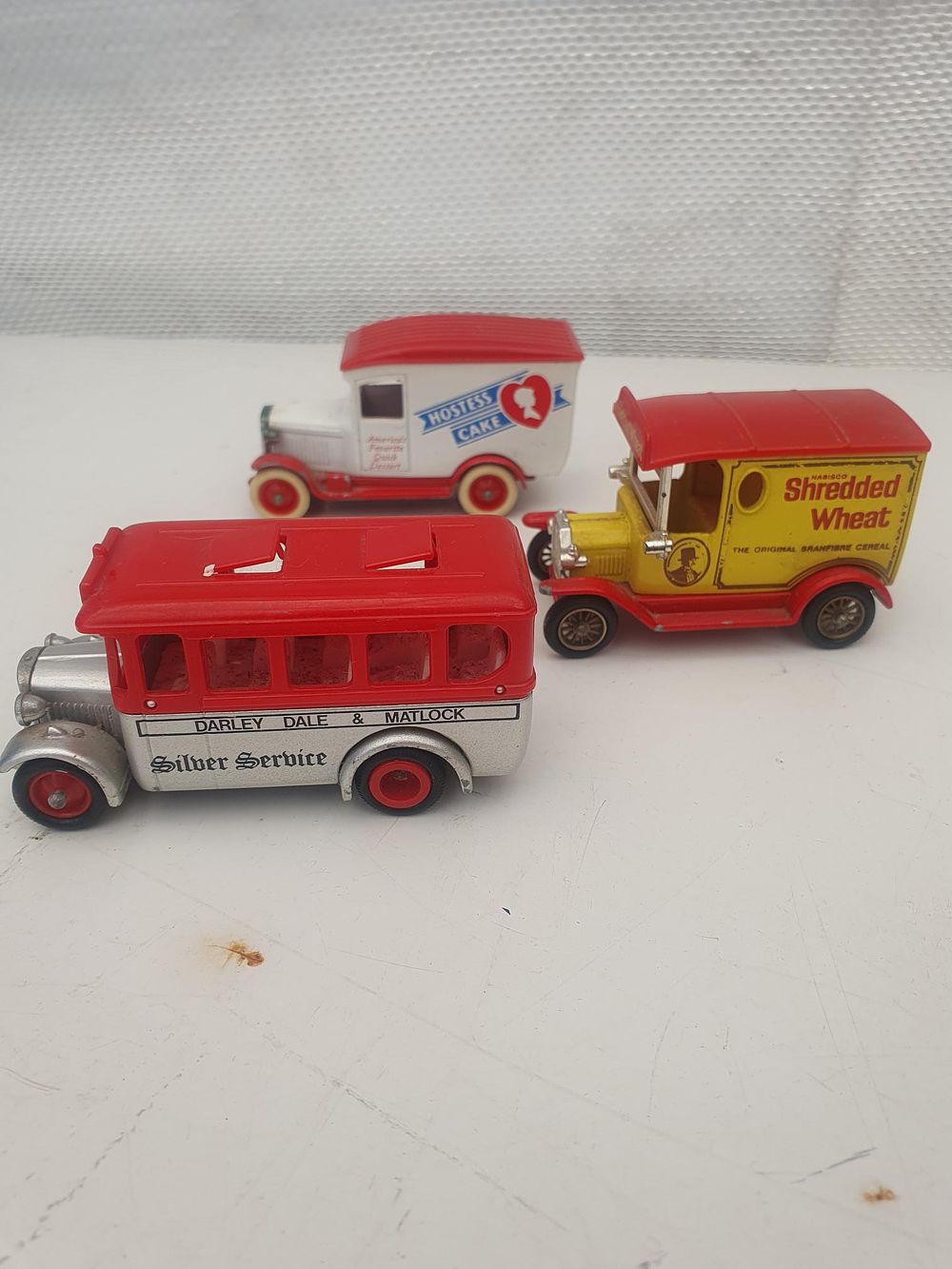 Lot 385: Three Lledo Days Gone Series Die-Cast Model Delivery Vehicles