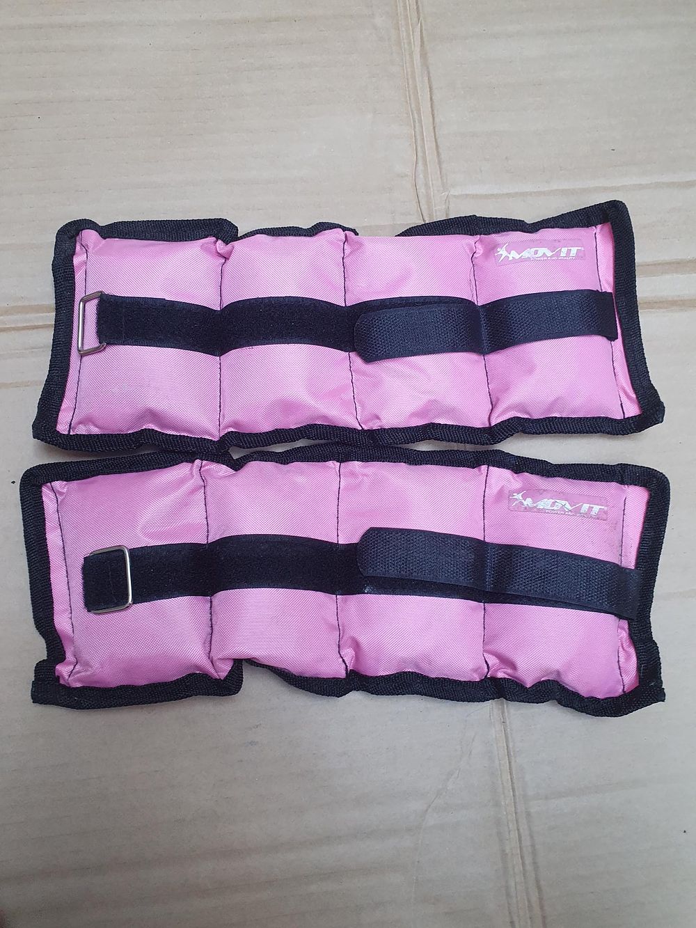 Lot 370: A Pair of MOVIT Pink Adjustable Ankle and Wrist Weights