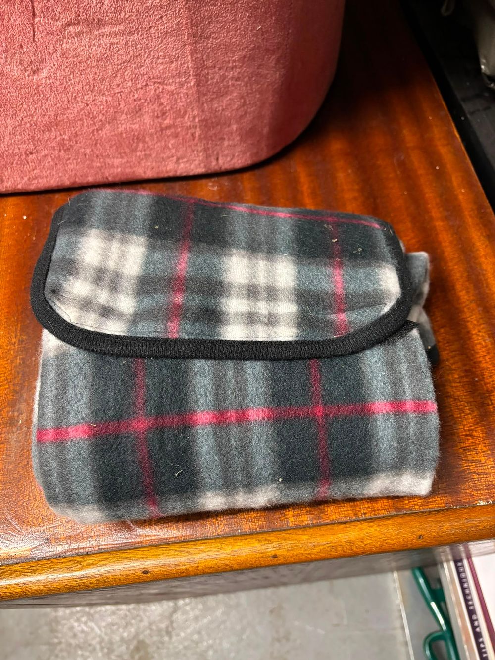 Lot 294: A Modern Fleece Travel Rug with Integrated Handle and Plaid Pattern, New